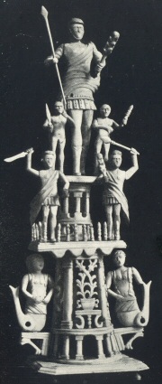 Plate IX.—Emblematic Group of Seven Figures arranged in
Three Tiers carved in Bone (Peterborough Museum)